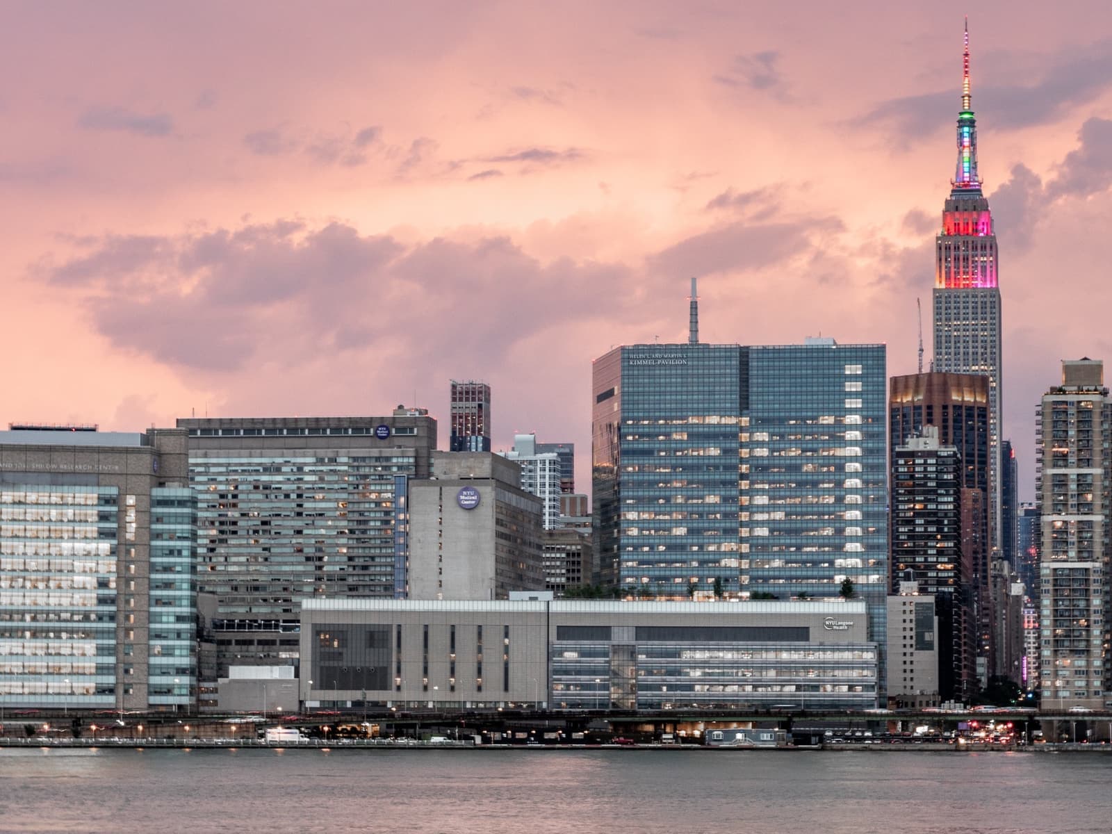 Hospital towers along the Manhattan waterfront at dusk, seen across the river