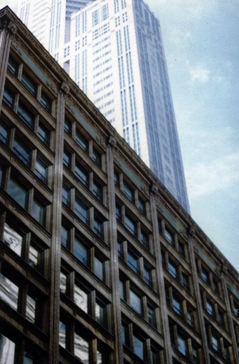 A Loop street between tall buildings in 1993