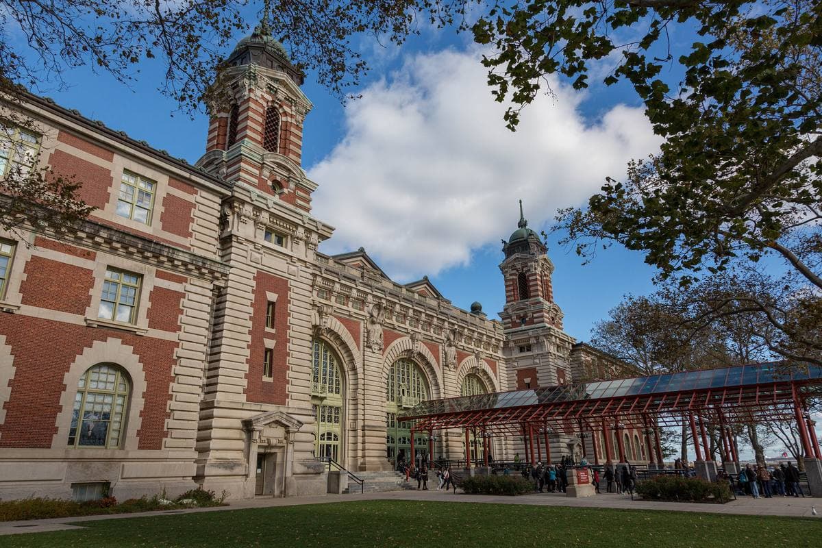 The red-brick main building of Ellis Island with its four domed towers