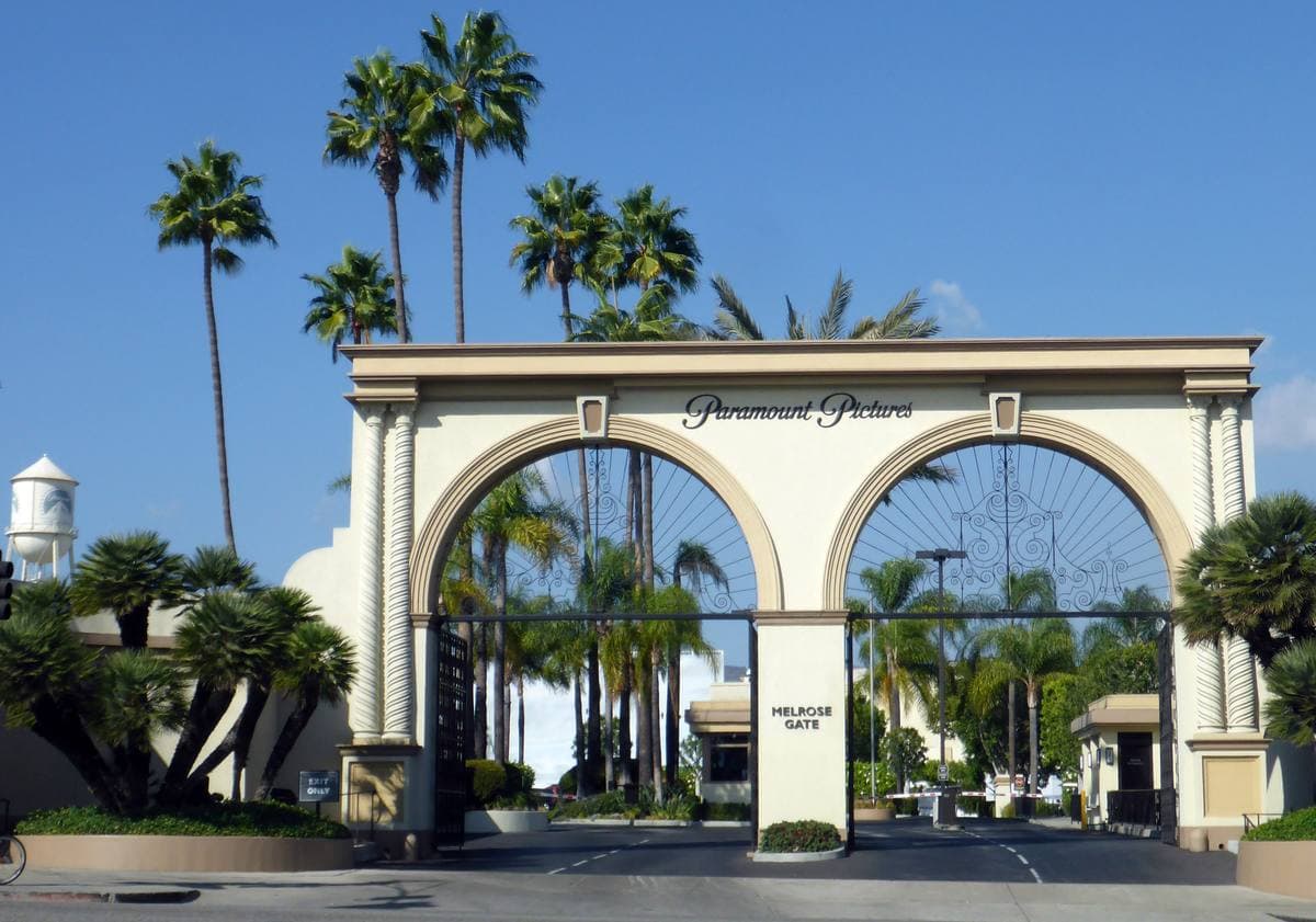 The white arched studio gate on Melrose Avenue with the Paramount name above it