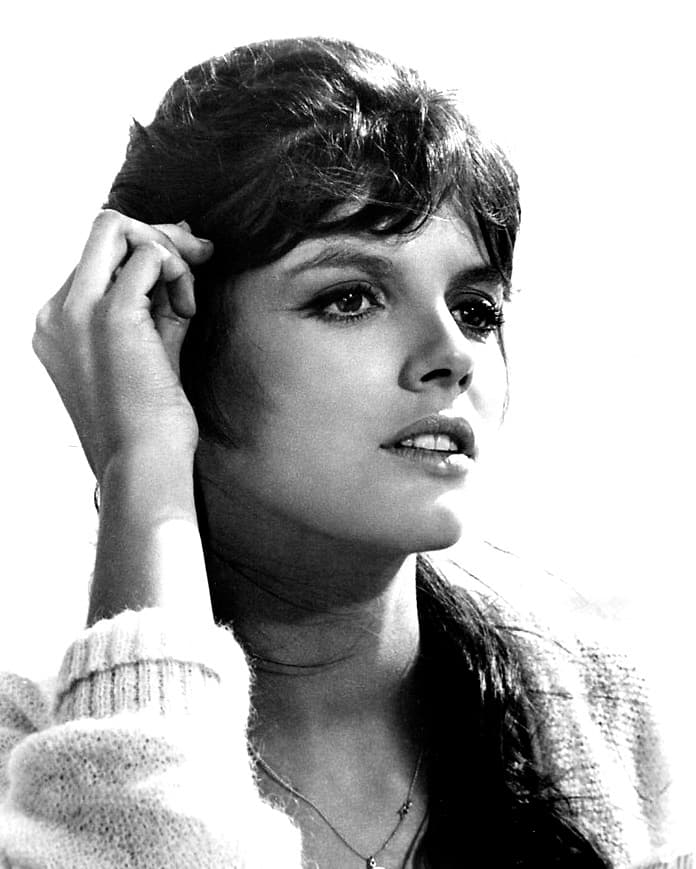 Black-and-white publicity portrait of Katharine Ross with long dark hair