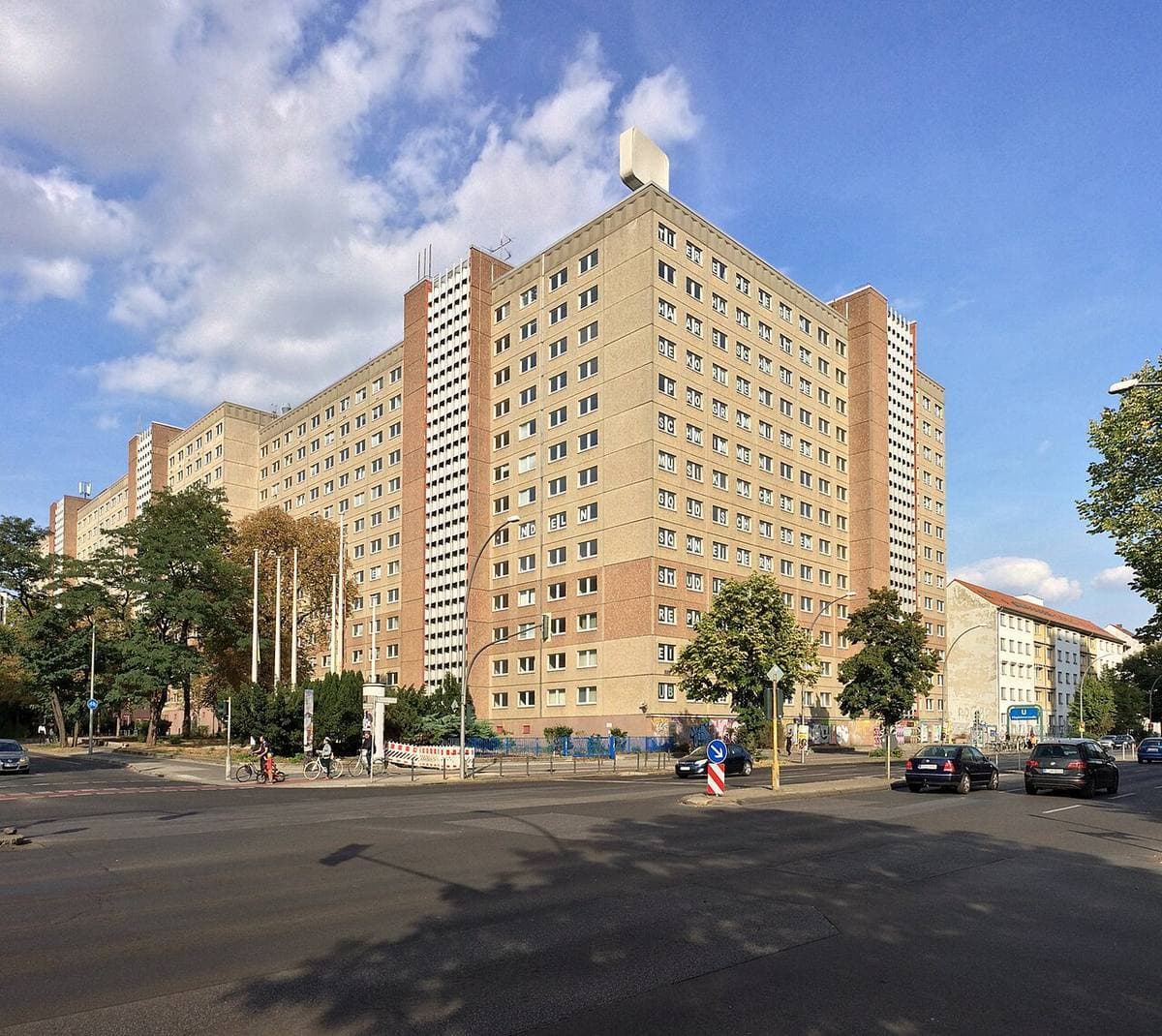 A tall block of the former Stasi headquarters over Frankfurter Allee