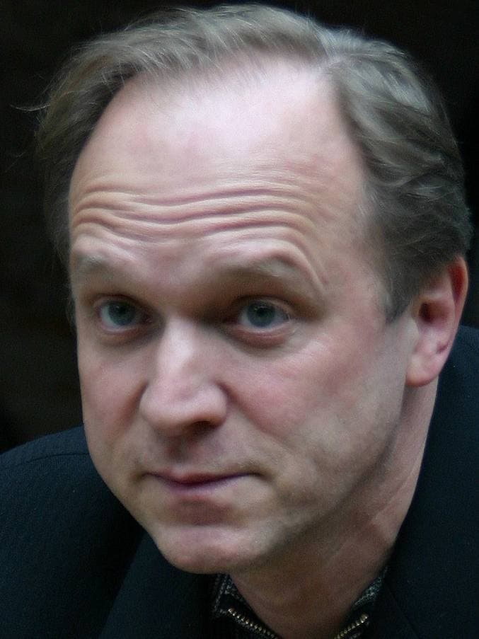 Ulrich Tukur looking straight at the camera