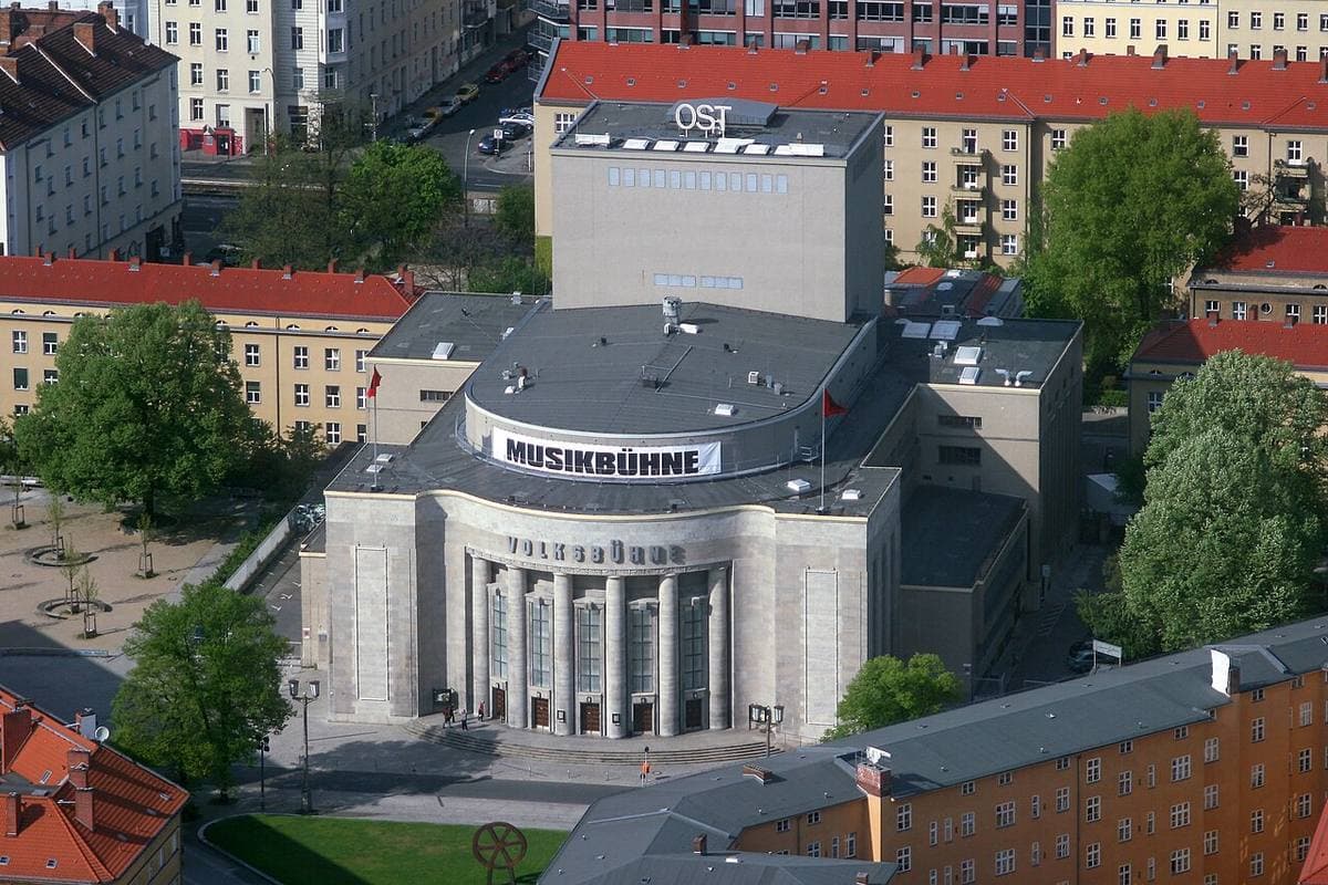 The rounded Volksbühne theatre seen from a height, its roof lettered