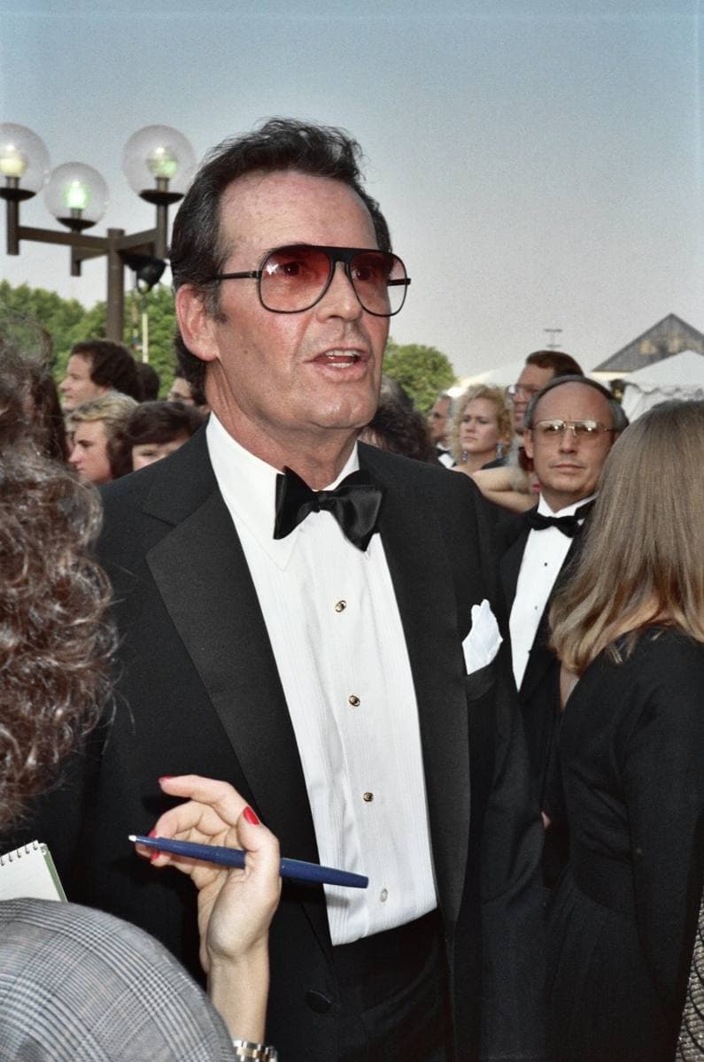 James Garner in a dinner jacket and tinted glasses