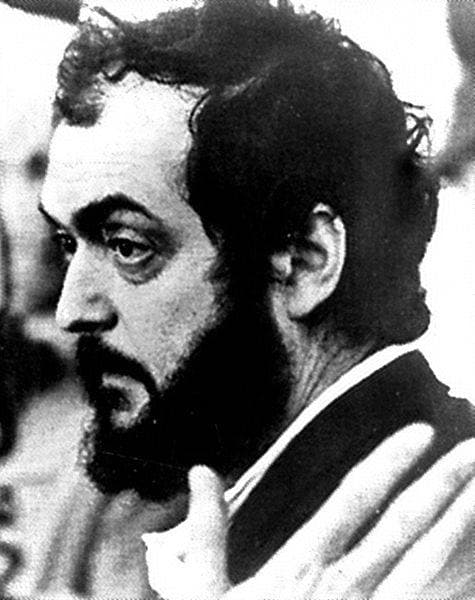 Stanley Kubrick in profile, bearded, with dark curly hair, in black and white