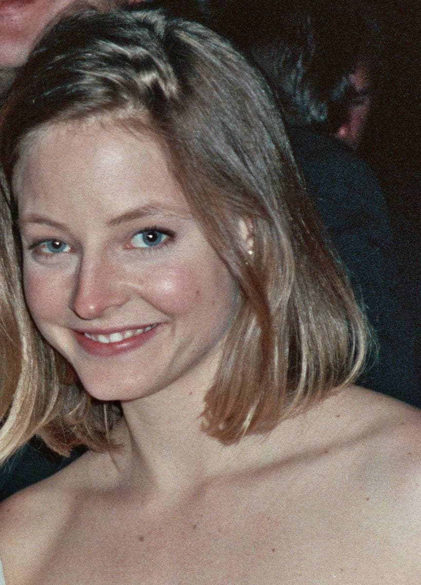 Jodie Foster smiling, with a shoulder-length bob