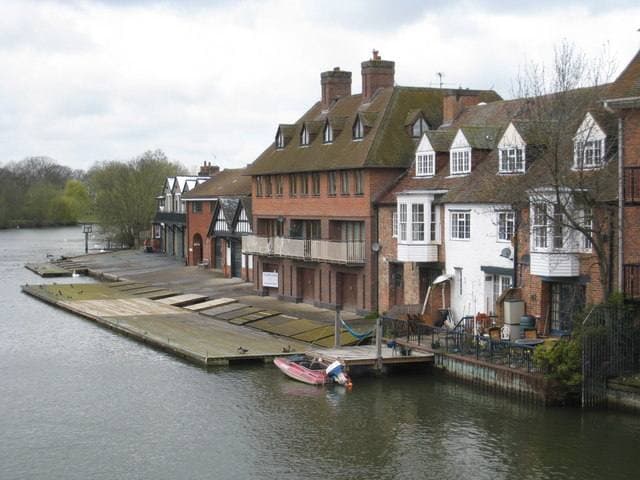 Riverside boathouses with slipways on the Thames