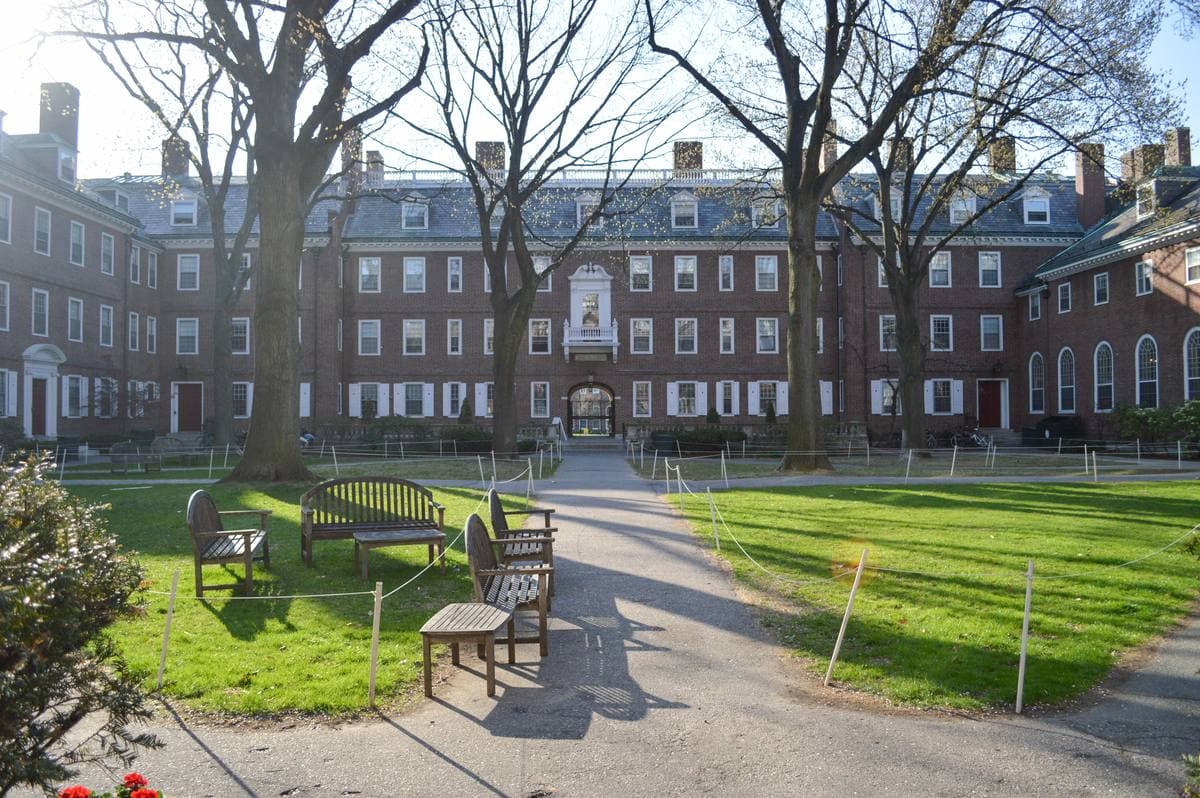 A Georgian brick courtyard with benches and a path