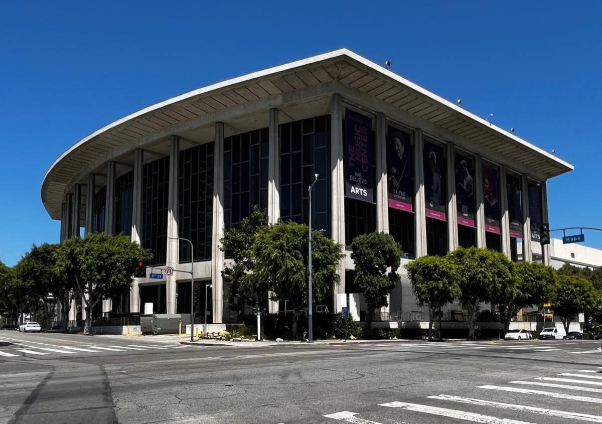 A colonnaded concert hall above a plaza