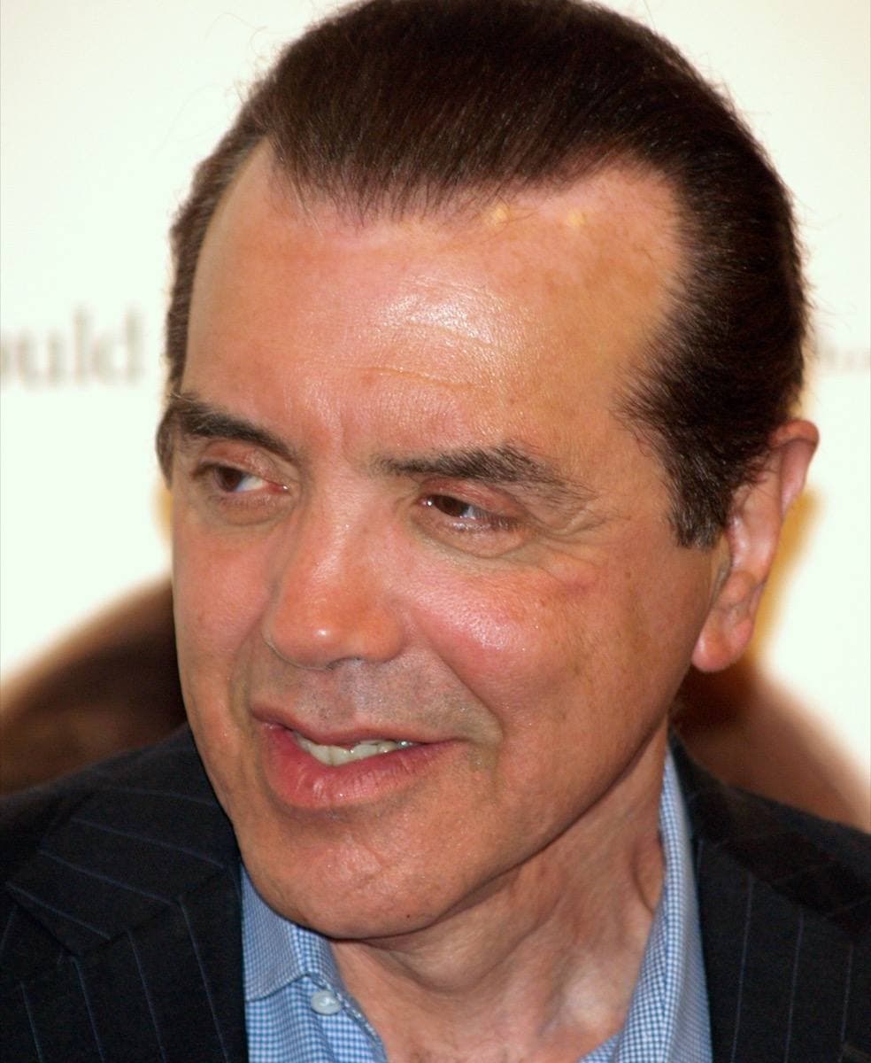 Chazz Palminteri in a dark suit