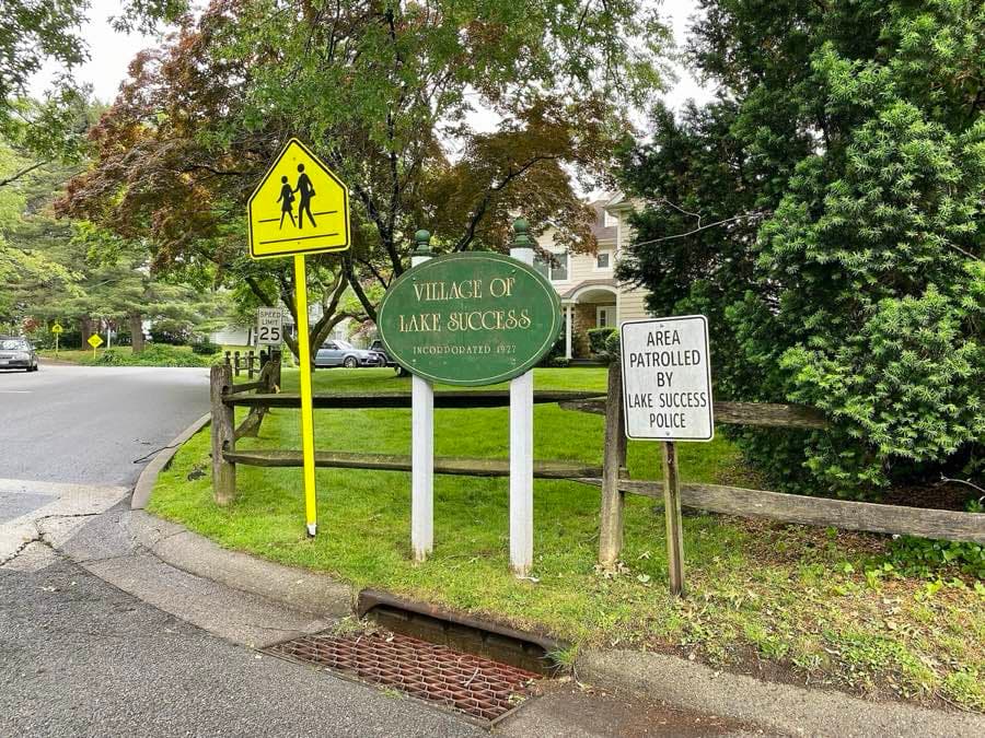 A welcome sign for the village of Lake Success
