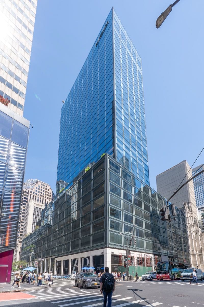 A tall glass office tower on Fifth Avenue