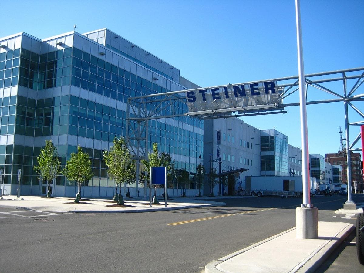 Long low studio buildings with a sign for Steiner Studios