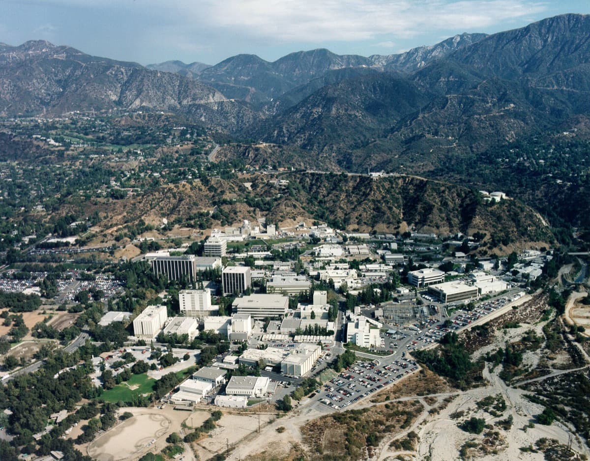 Aerial view of laboratory buildings against hills
