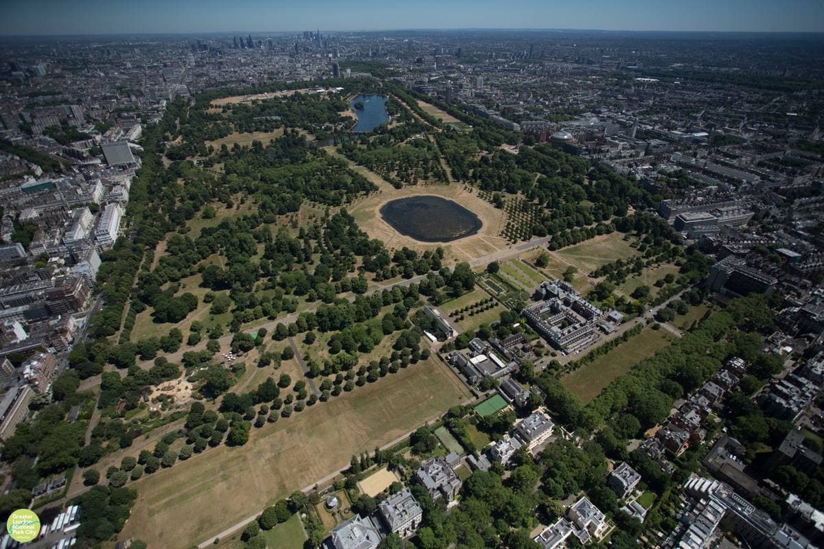 Hyde Park from the air: green lawns, the Serpentine and the West End beyond