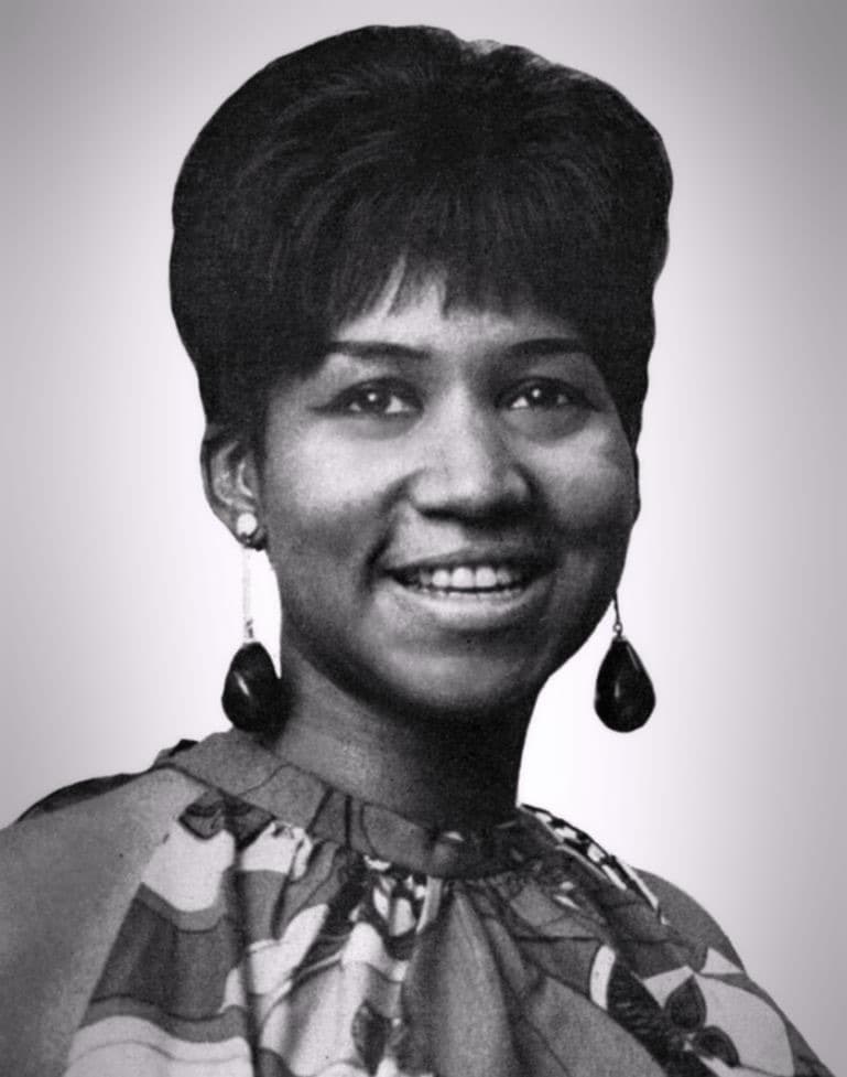 Aretha Franklin in a black-and-white portrait, looking past the camera