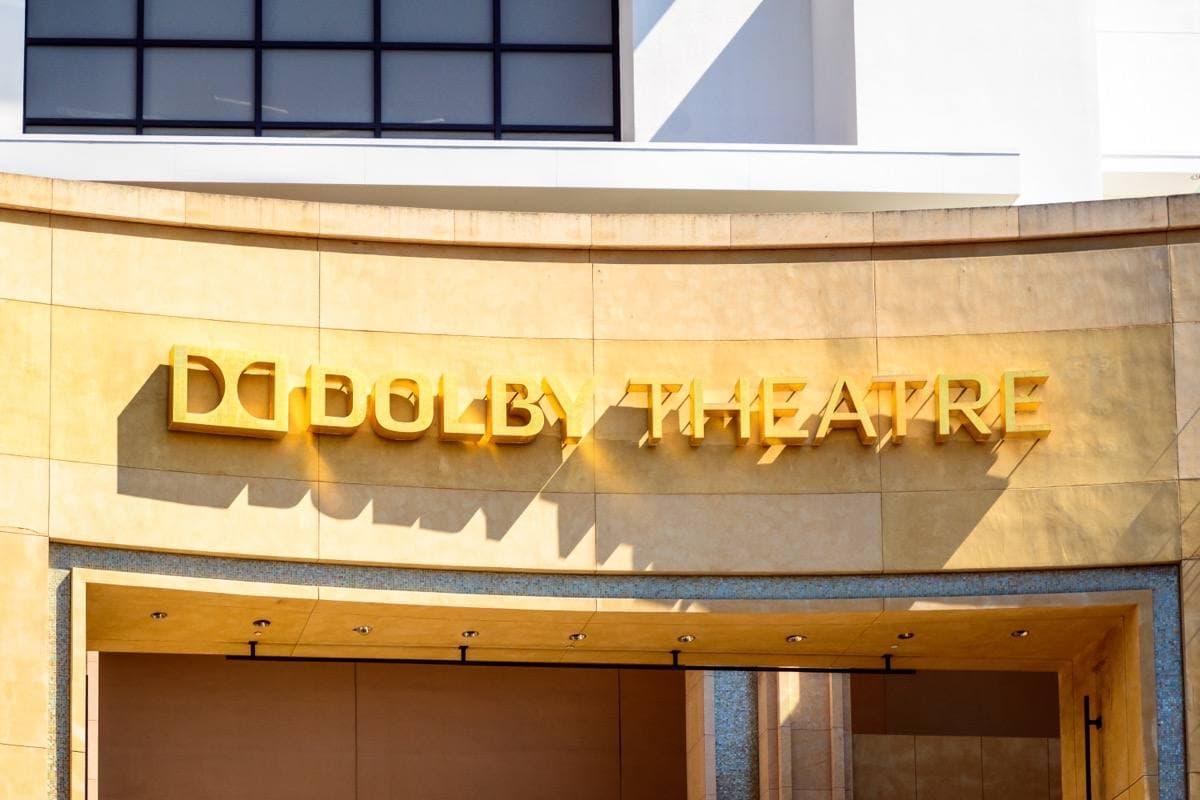 A tall theatre entrance on Hollywood Boulevard with columns and banners
