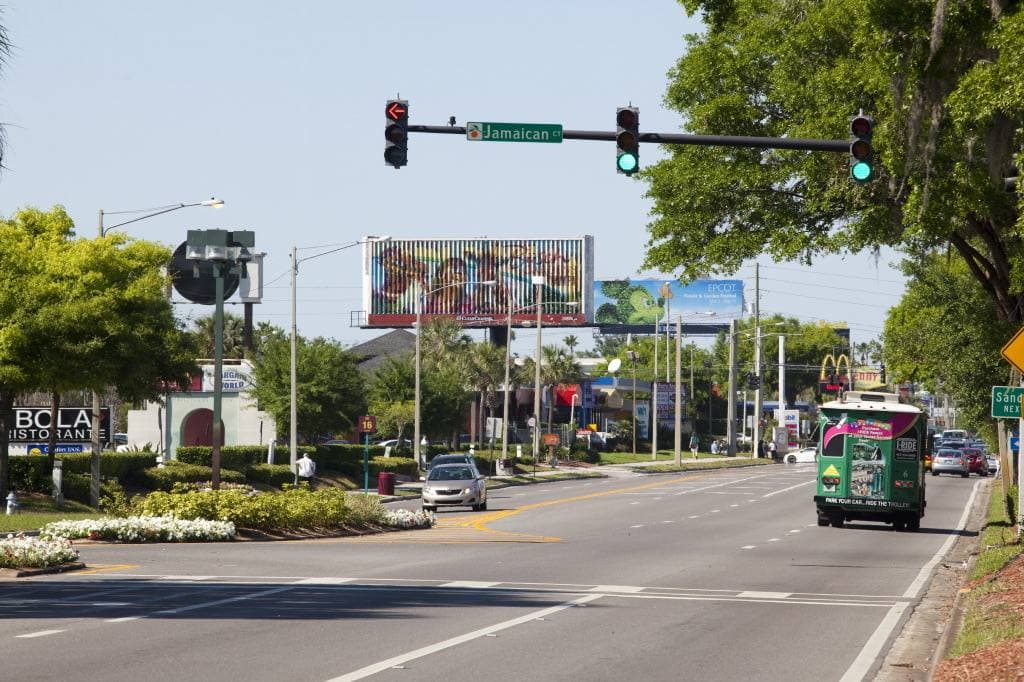 A wide Orlando boulevard lined with palms and hotels, 2011