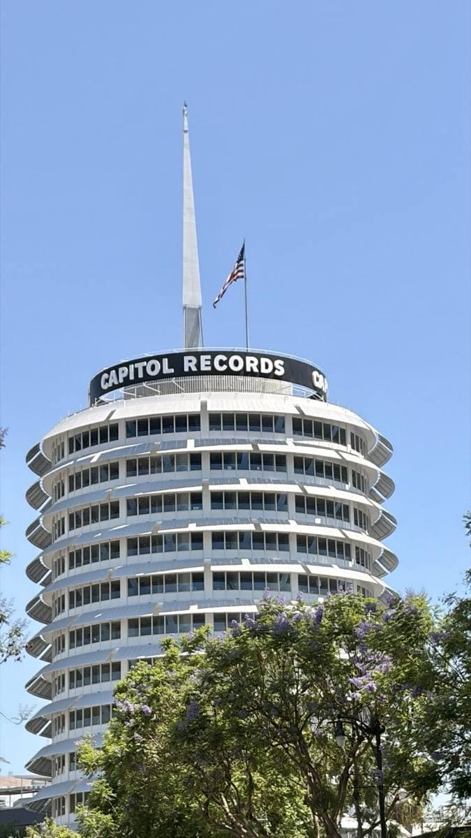 The round Capitol Records Tower against a blue sky