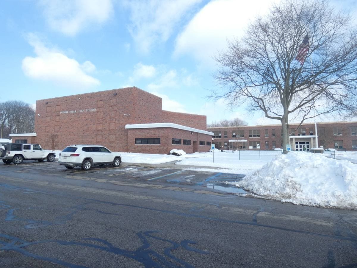 A side entrance of Ottawa Hills High School with its name over the door