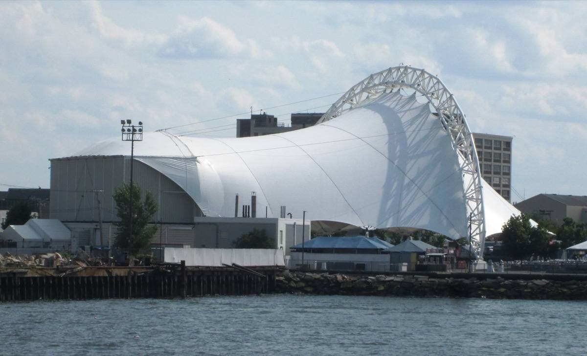 A white tent-roofed amphitheatre on the Boston waterfront