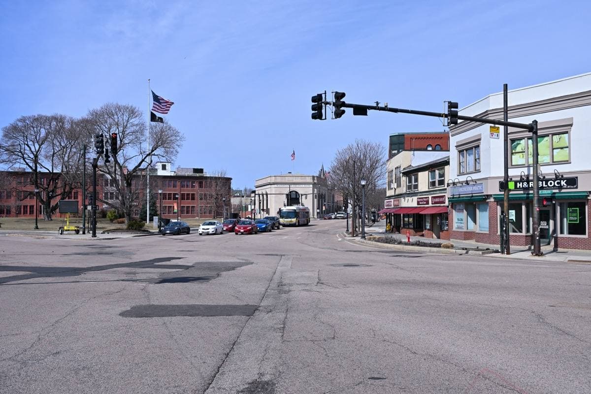 Watertown Square looking west, with shops and a bus