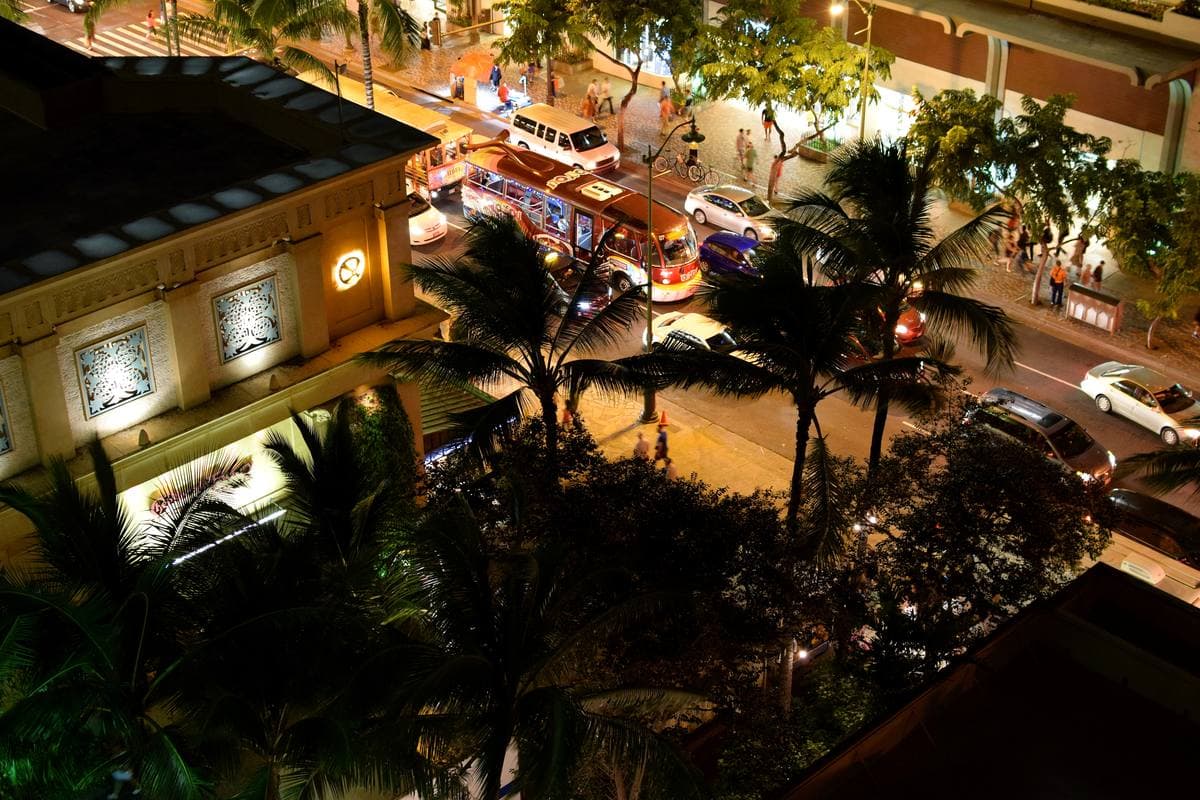 Waikiki's hotels lit up at night along the beach