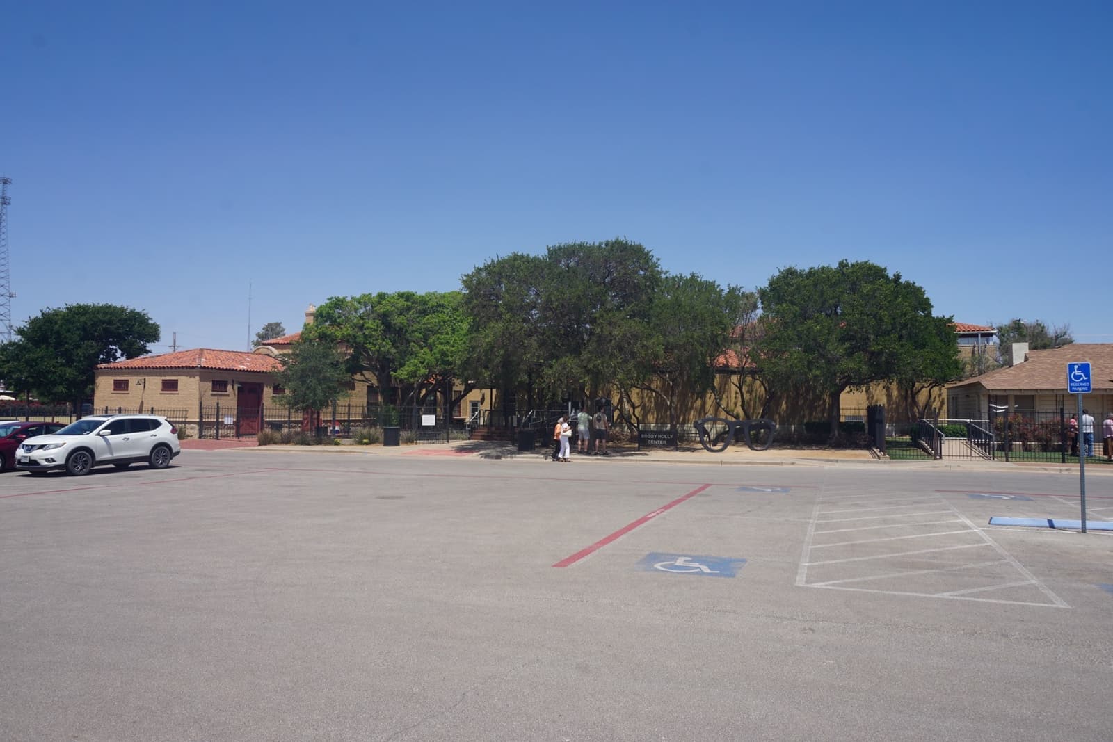 The Buddy Holly Center, a brick former railway depot, under a blue sky