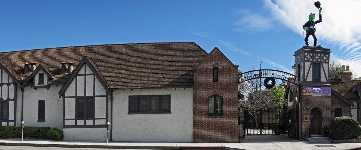 A row of Tudor-style cottage studio buildings along La Brea Avenue