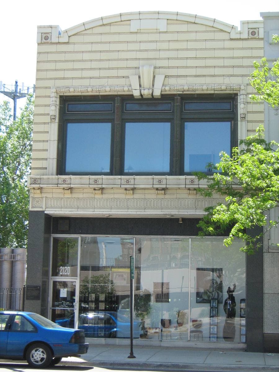 The narrow terracotta-trimmed front of 2120 South Michigan Avenue