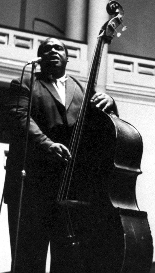 Willie Dixon playing an upright bass on stage