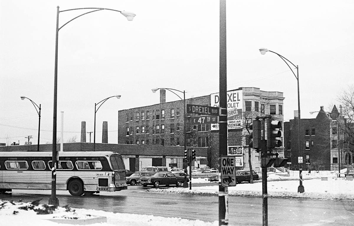 A 1978 view of 47th Street with shops and a sign pointing to Cottage Grove