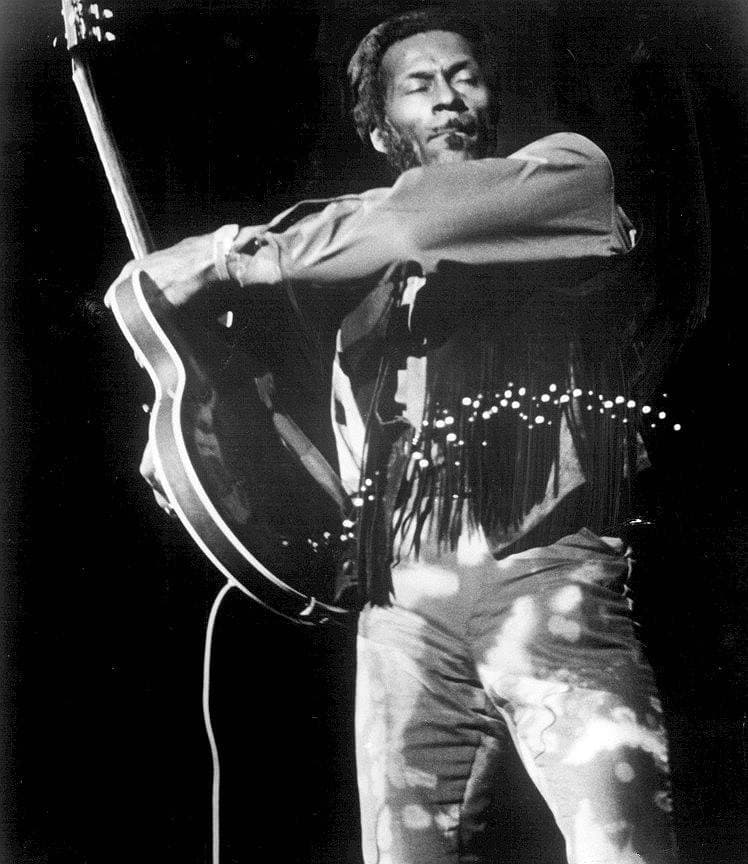 Chuck Berry playing guitar on stage in 1971