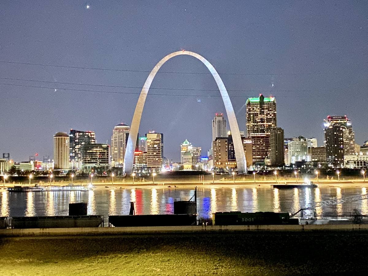 The St. Louis skyline and Gateway Arch across the river at dusk