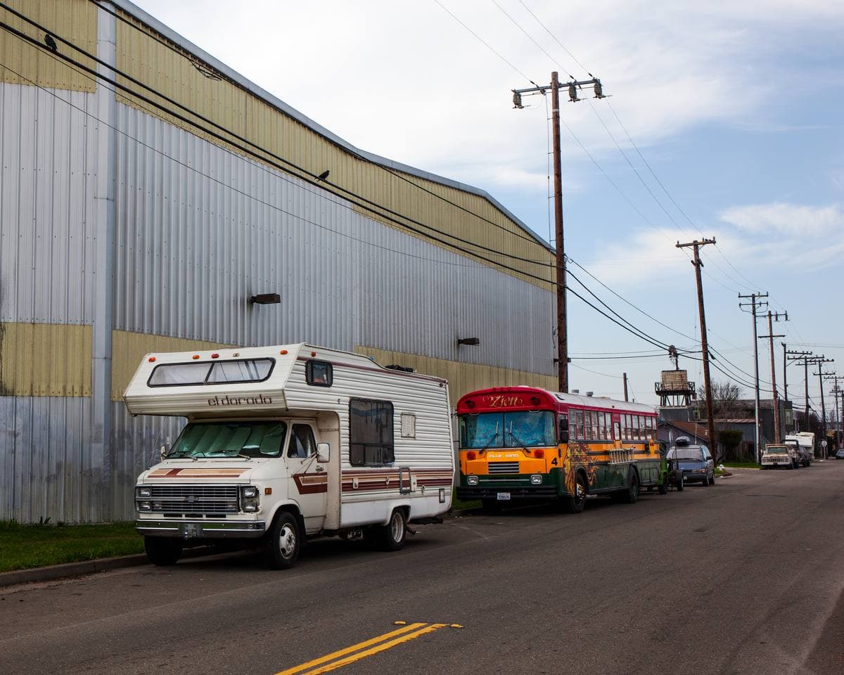An industrial street in West Berkeley with a parked bus