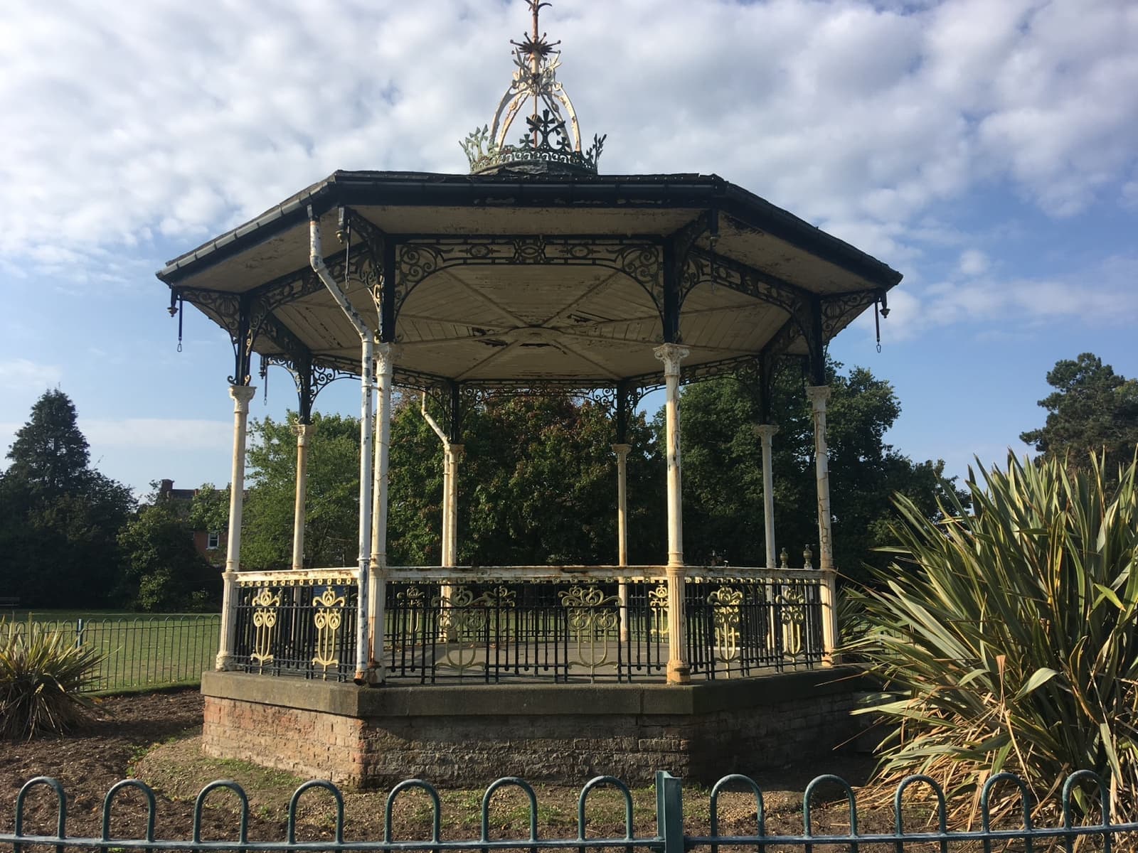 A Victorian iron bandstand in a park
