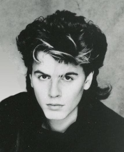 John Taylor in 1983 with a dark fringe over one eye