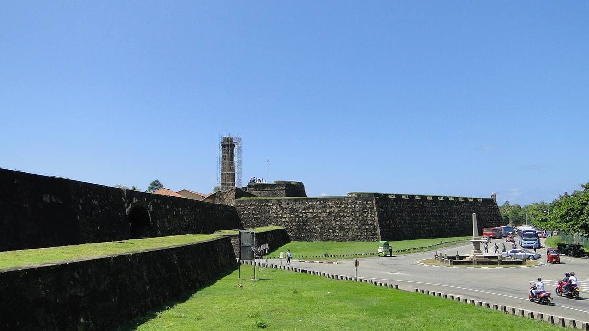 Grassy stone ramparts of Galle Fort above the sea