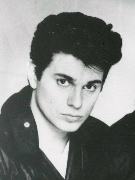 Roger Taylor in 1983 with dark, swept hair