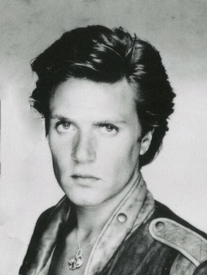 Simon Le Bon in 1983, tall, fair hair swept back, in a pale jacket