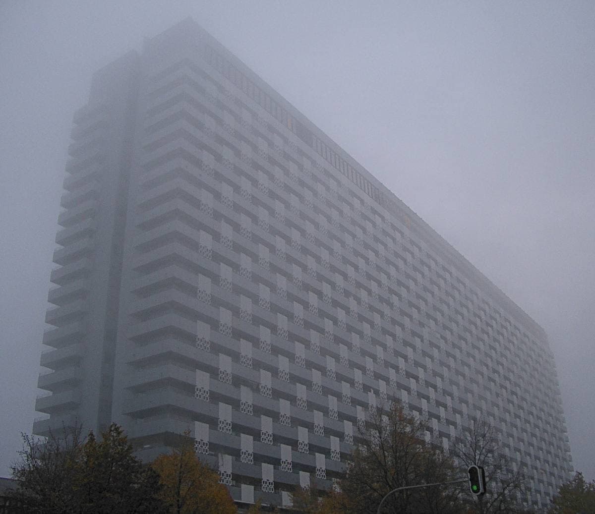 The Arabella high-rise fading into fog
