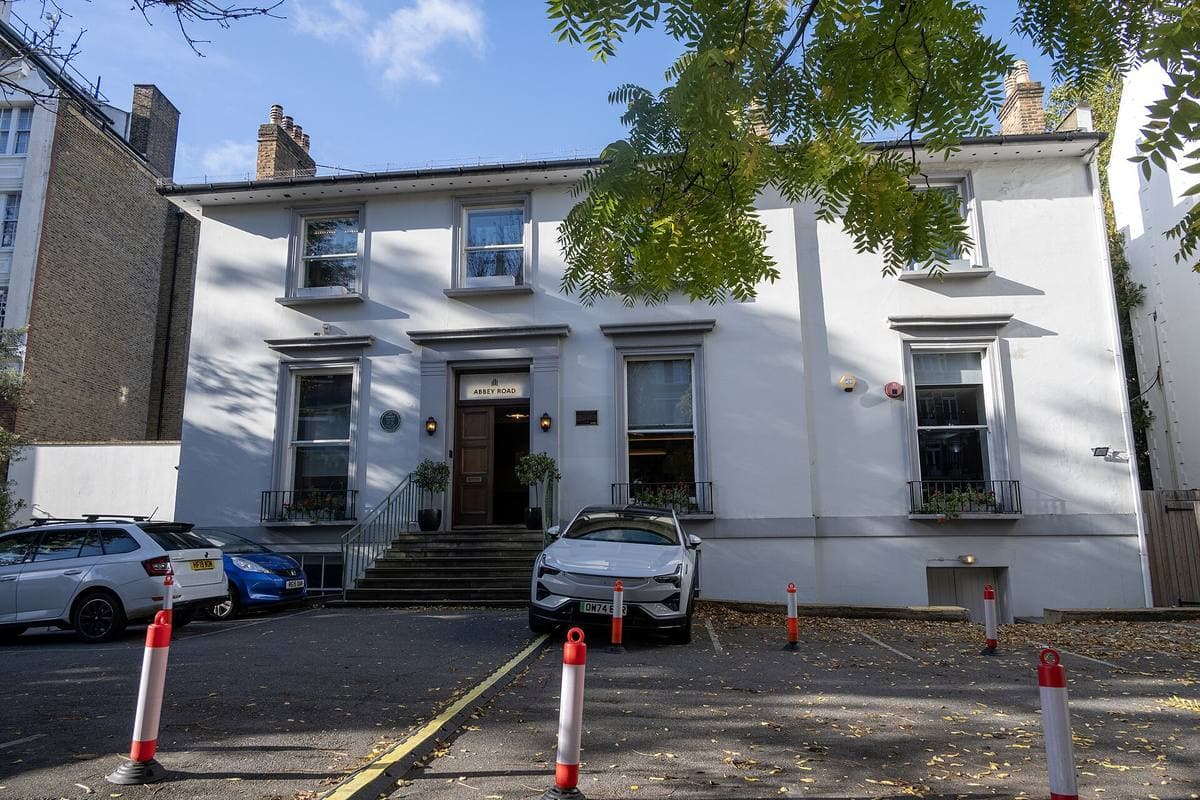 The white front of Abbey Road Studios behind its low wall