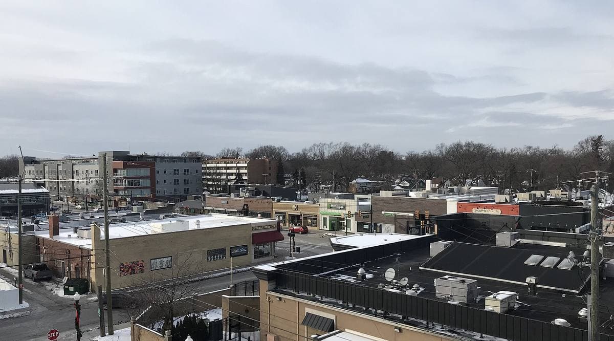 A street of low brick shopfronts in downtown Ferndale in winter