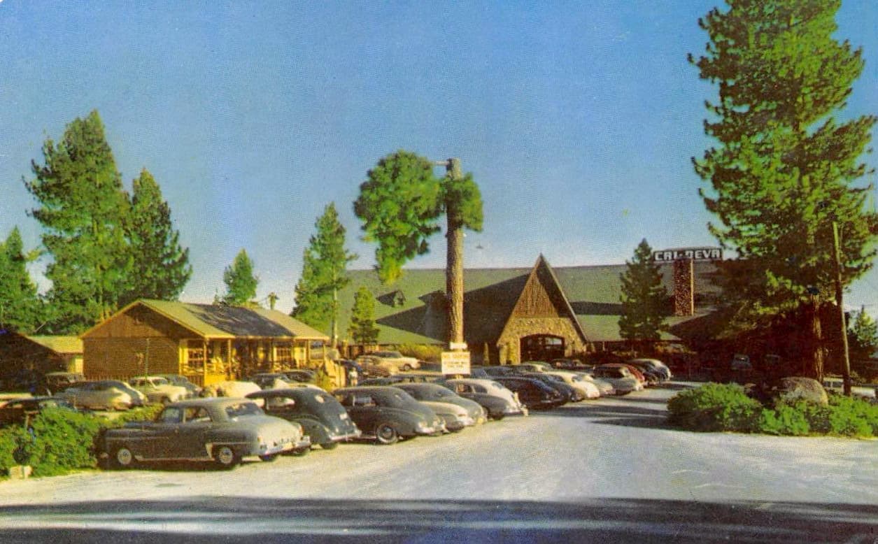 A postcard view of a lodge on the shore of Lake Tahoe