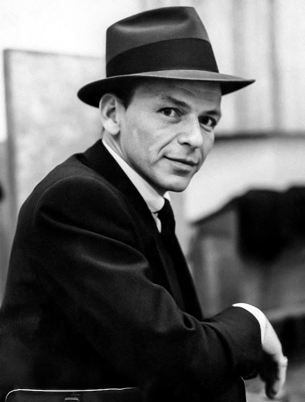 Frank Sinatra in a hat, close up, in the recording studio