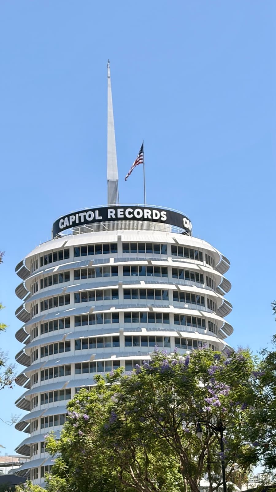 The round Capitol Records Tower against a blue sky