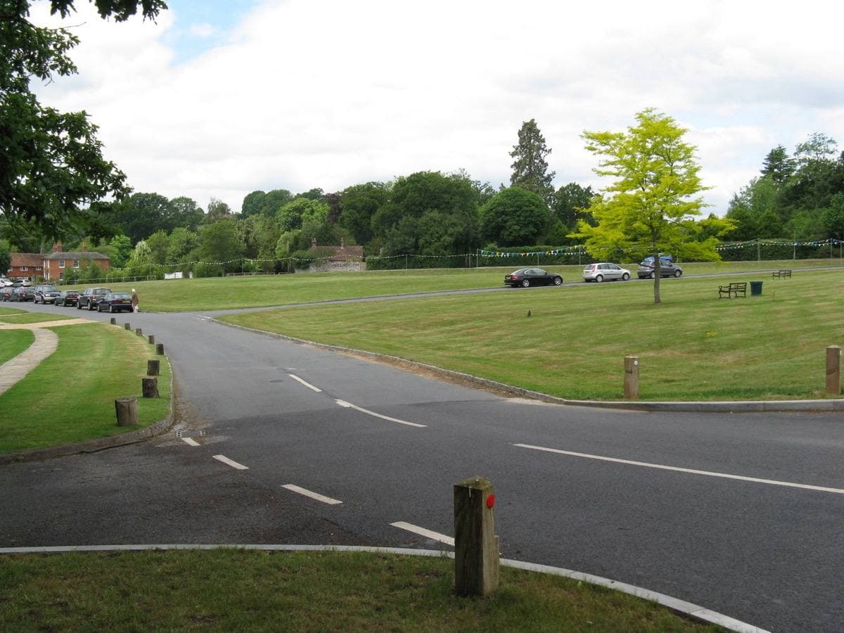 A wide village green with houses around it
