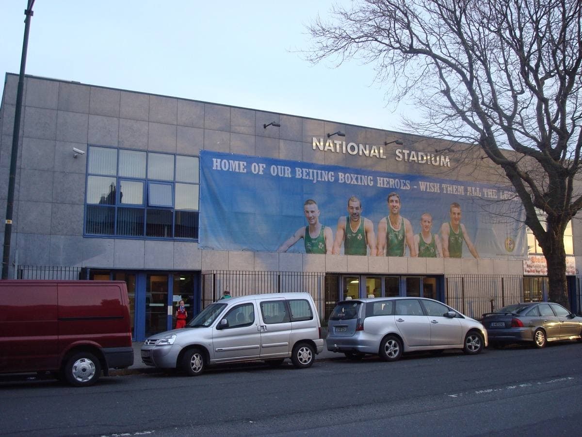 The front of a plain stadium building on a Dublin road