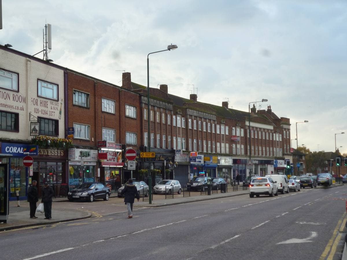 A parade of shops with flats above on Kingsbury Road in north-west London